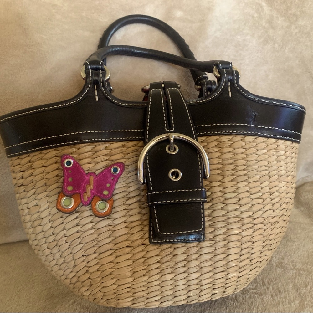 Vintage Coach straw tote bag , butterfly . It has slight separation on one side